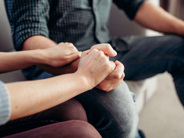 family supporting each other in group setting