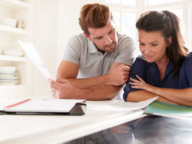 a couple reviewing paperwork