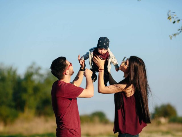 young family have fun and relaxing outdoors in the countryside