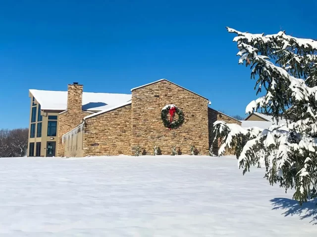 winter view in the snow with holiday wreath